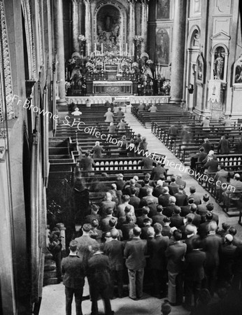 ST FRANCIS XAVIER CHURCH GARDINER ST  MEN STAND AT BACK